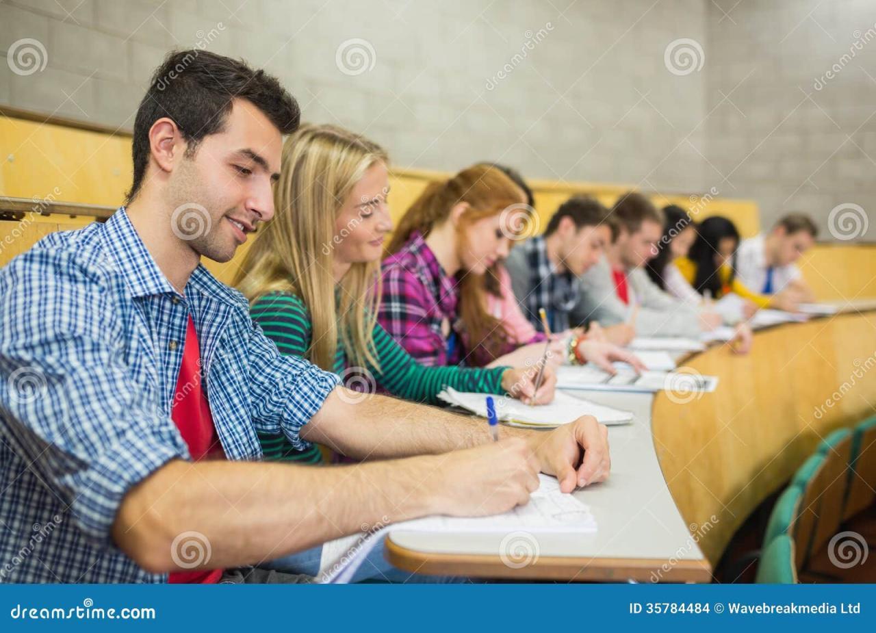 Students Writing Notes in Lecture Hall Stock Image - Image of indoors ...